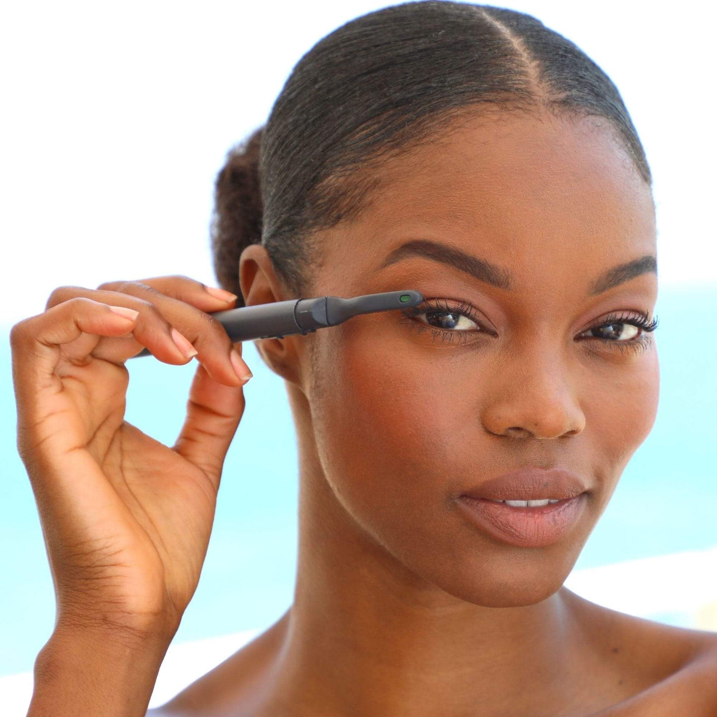 heated eyelash curler